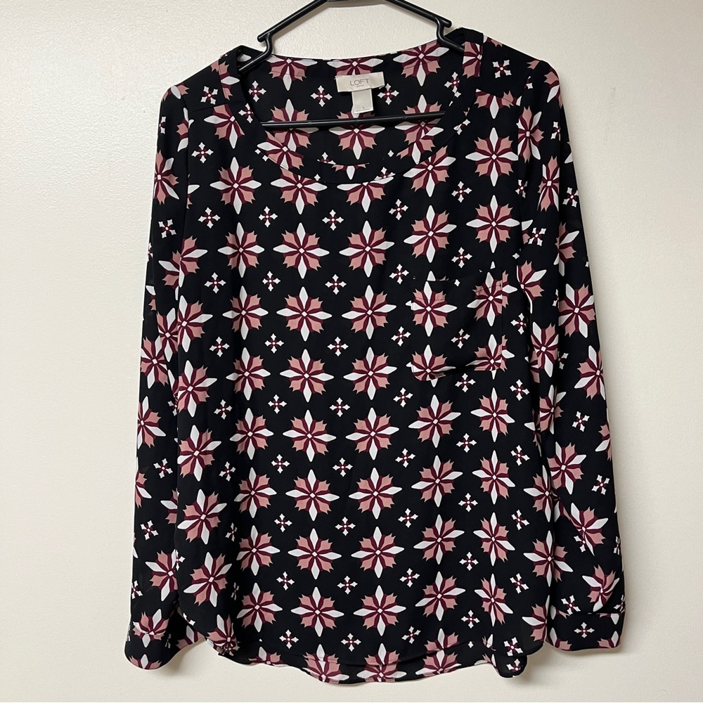 Loft sz Small black blouse with red,white, pink starburst patterns. Pre owned.
